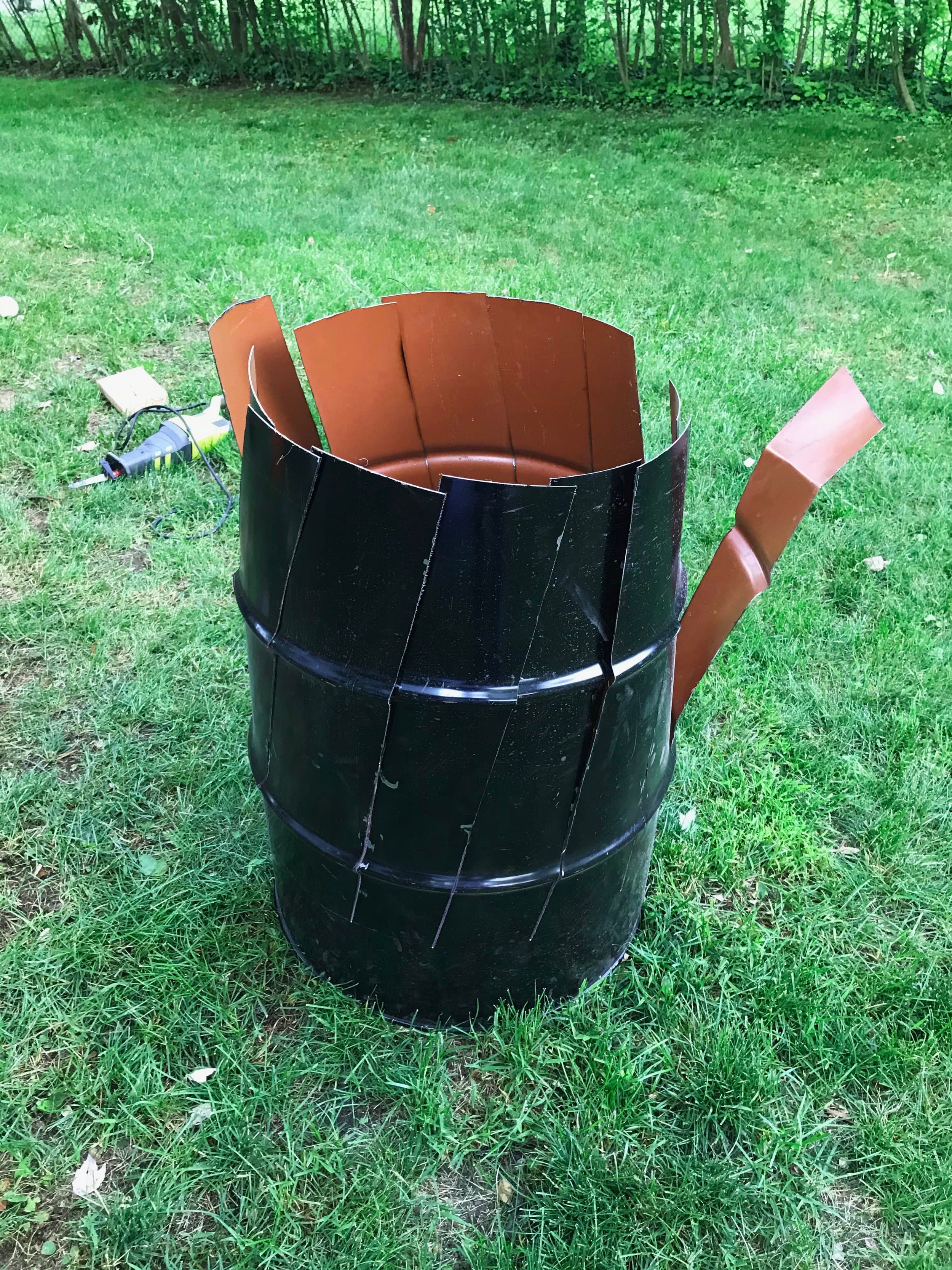 I then removed the top and cut diagonal slices down the sides of the drum.