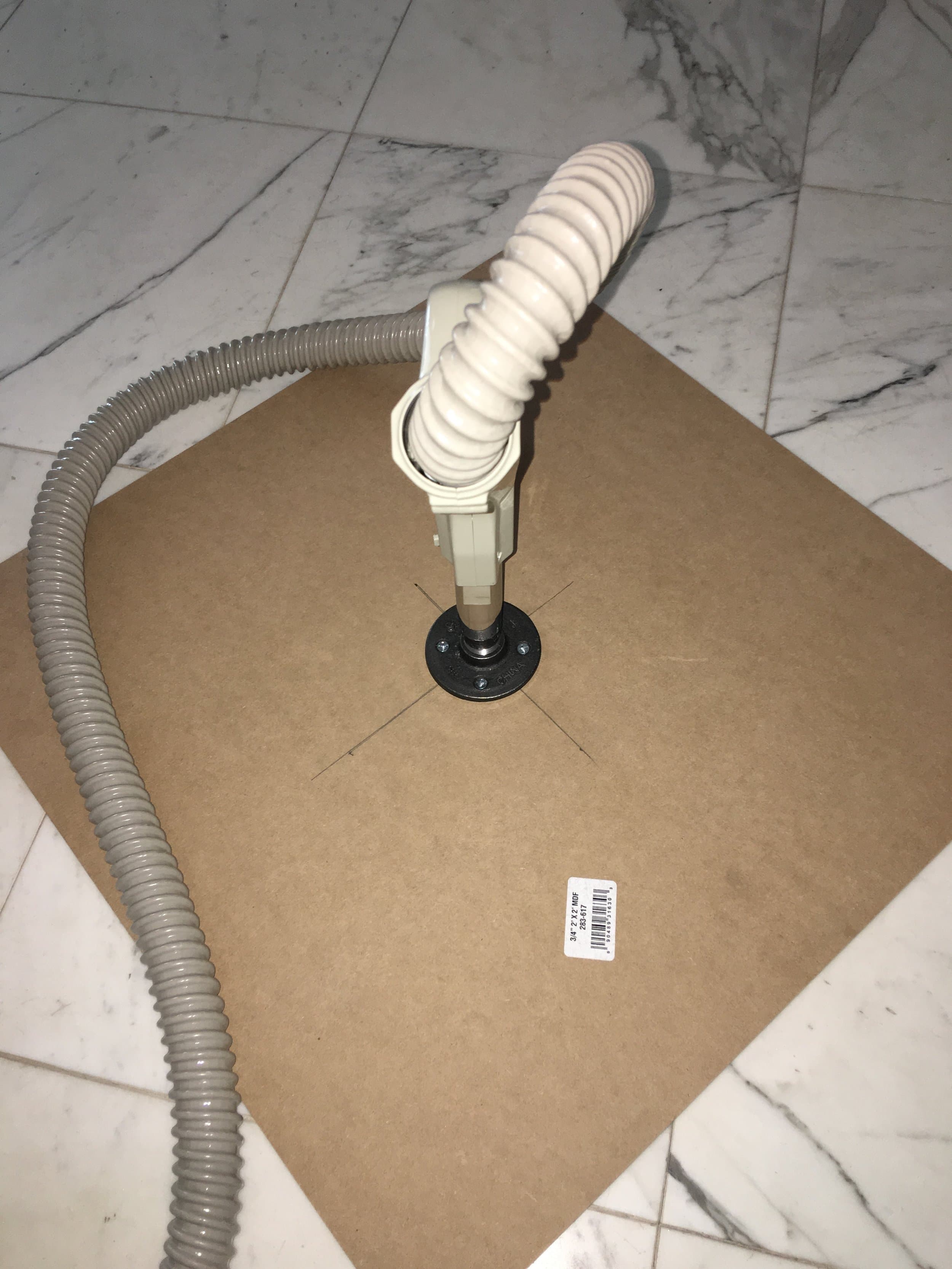 The vacuum hose was attached to the flange, to suck air through from the top of the sheet.