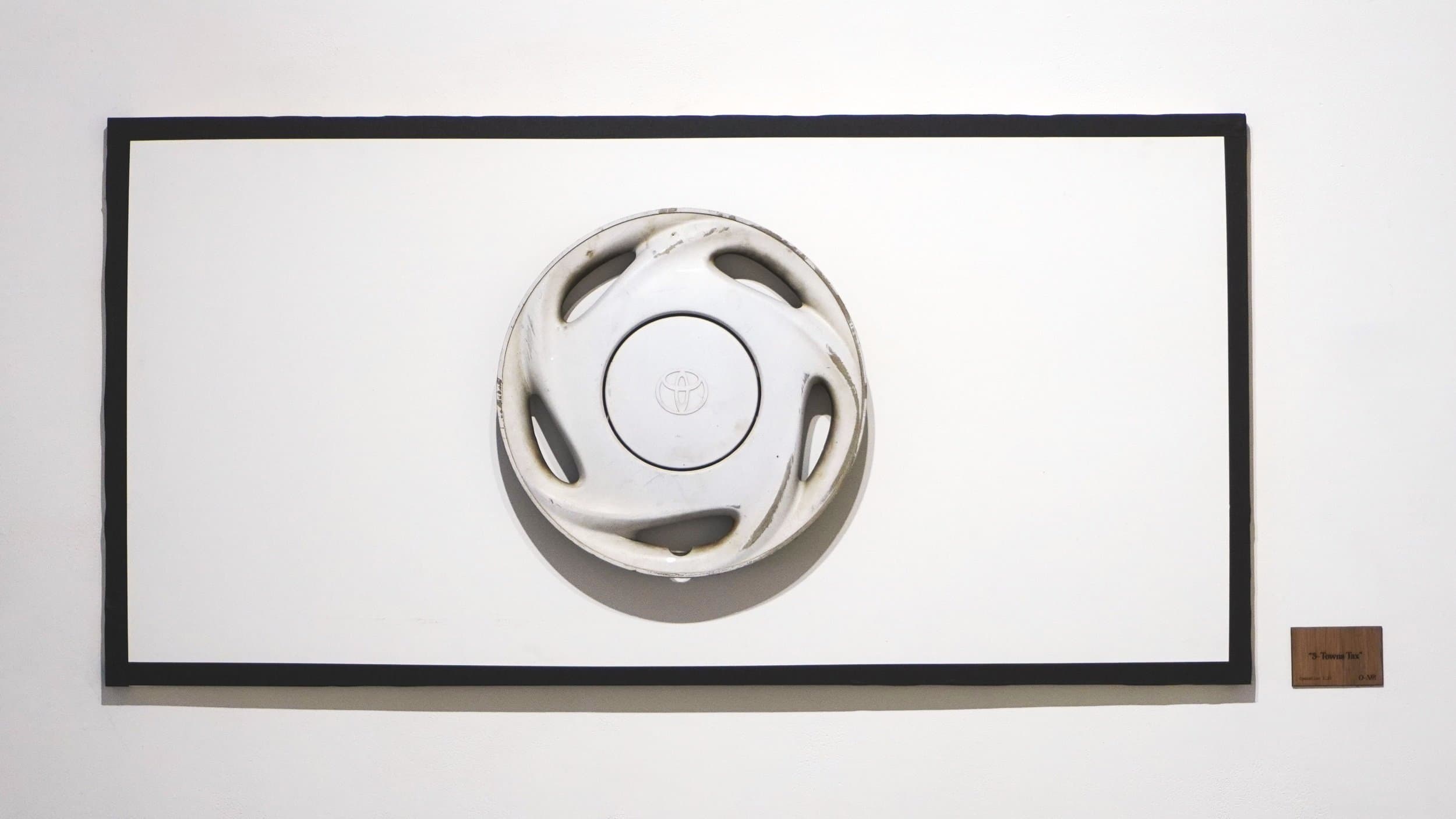 “Five Towns Tax” - 1999 Toyota Corolla hubcap