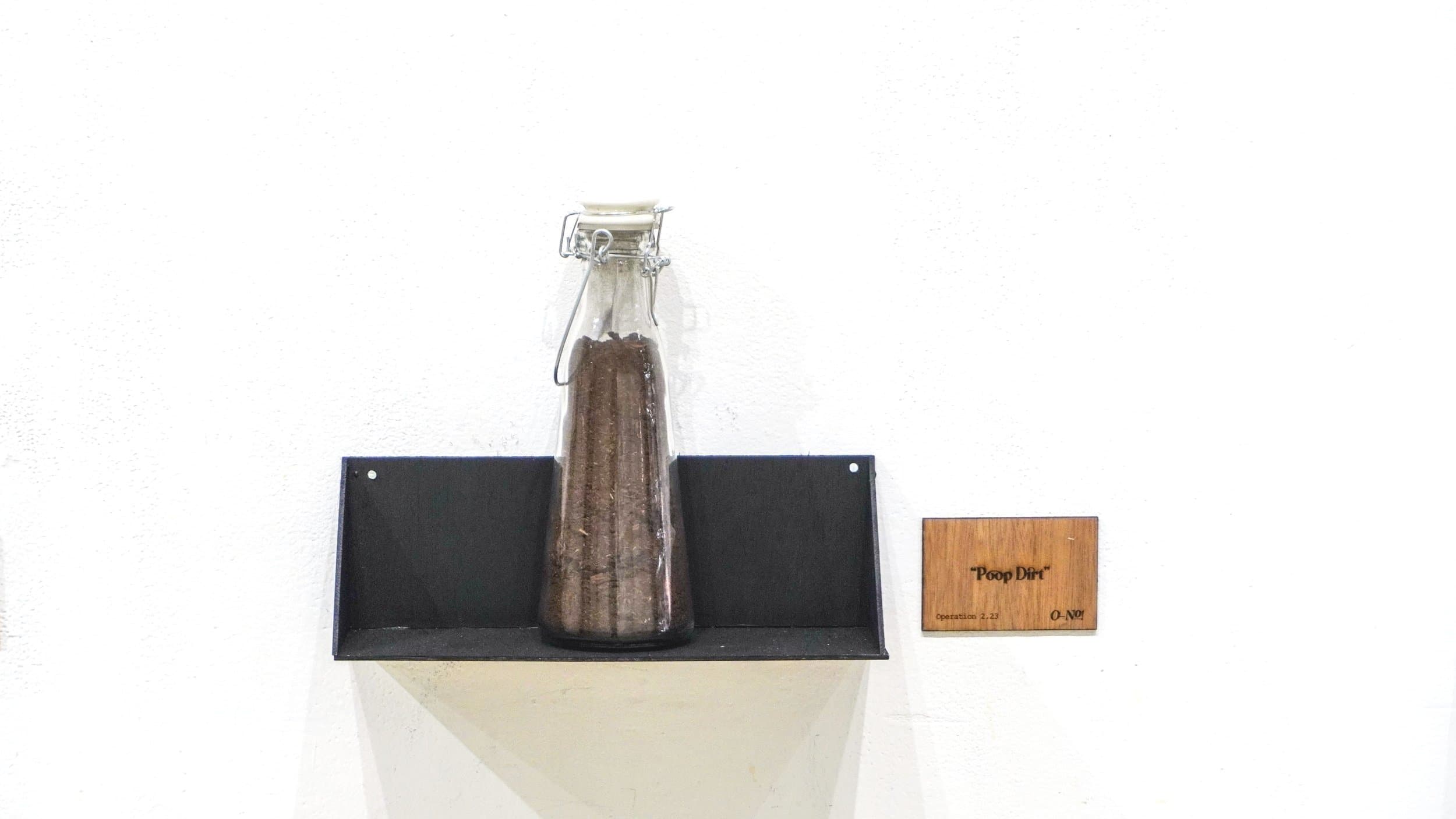 “Poop Dirt” - a jar filled with soil