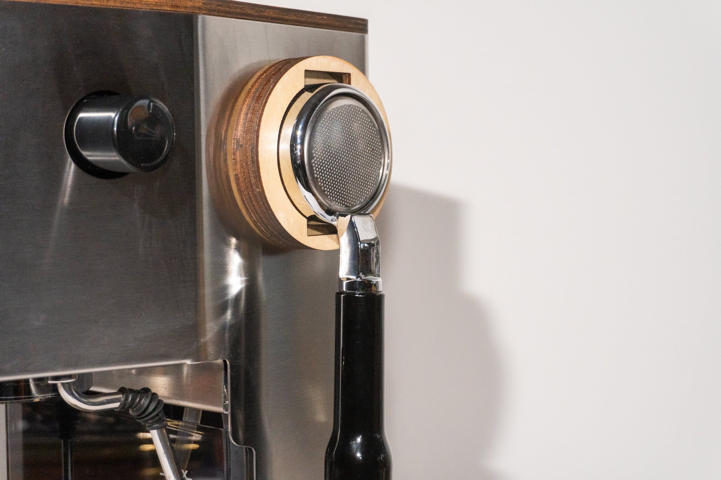 Portafilter dock mounted on espresso machine