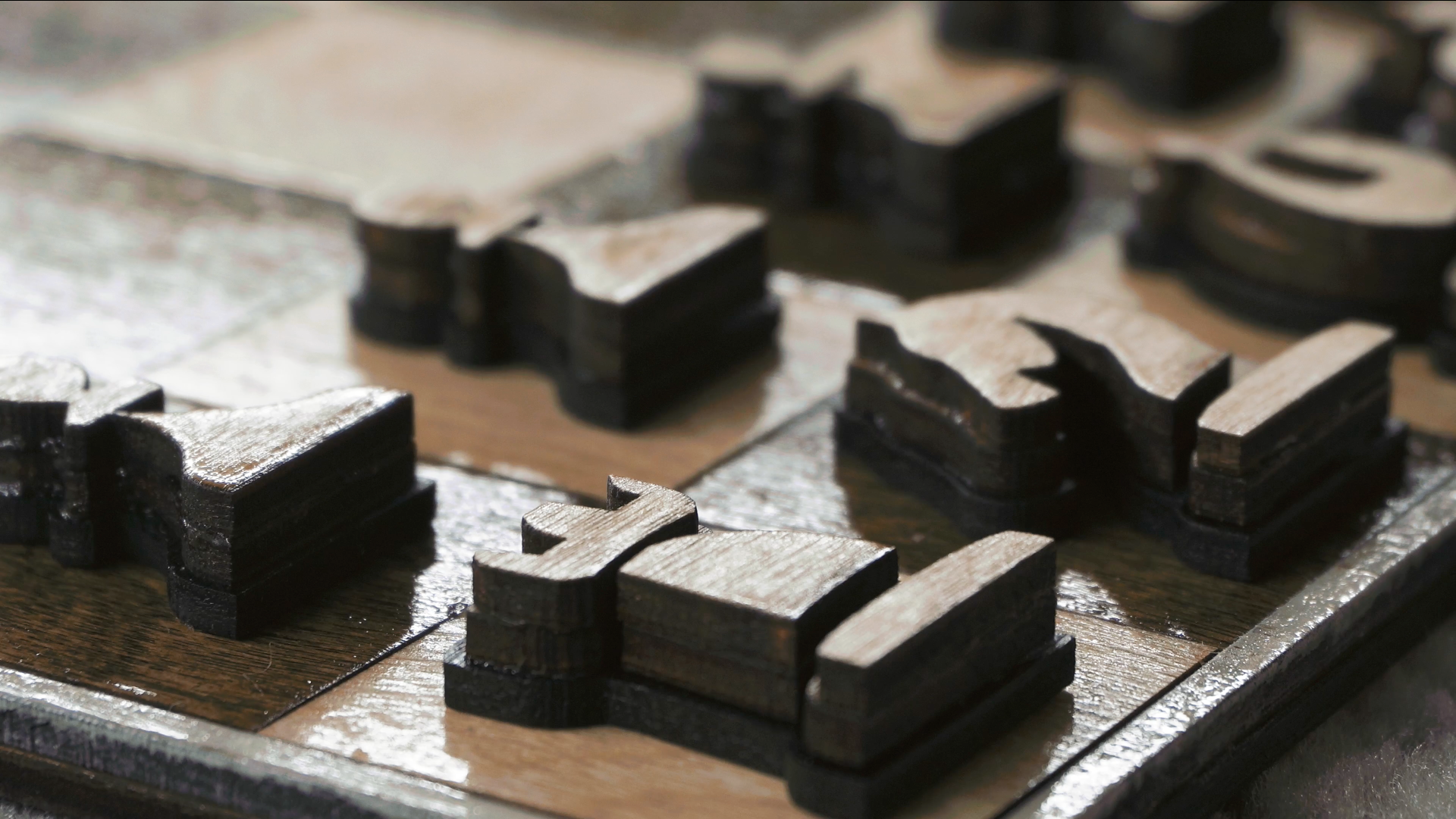 A closeup of the chess board. Each chess piece was made of multiple layers/sections. It was a tedious process but a beautiful result.