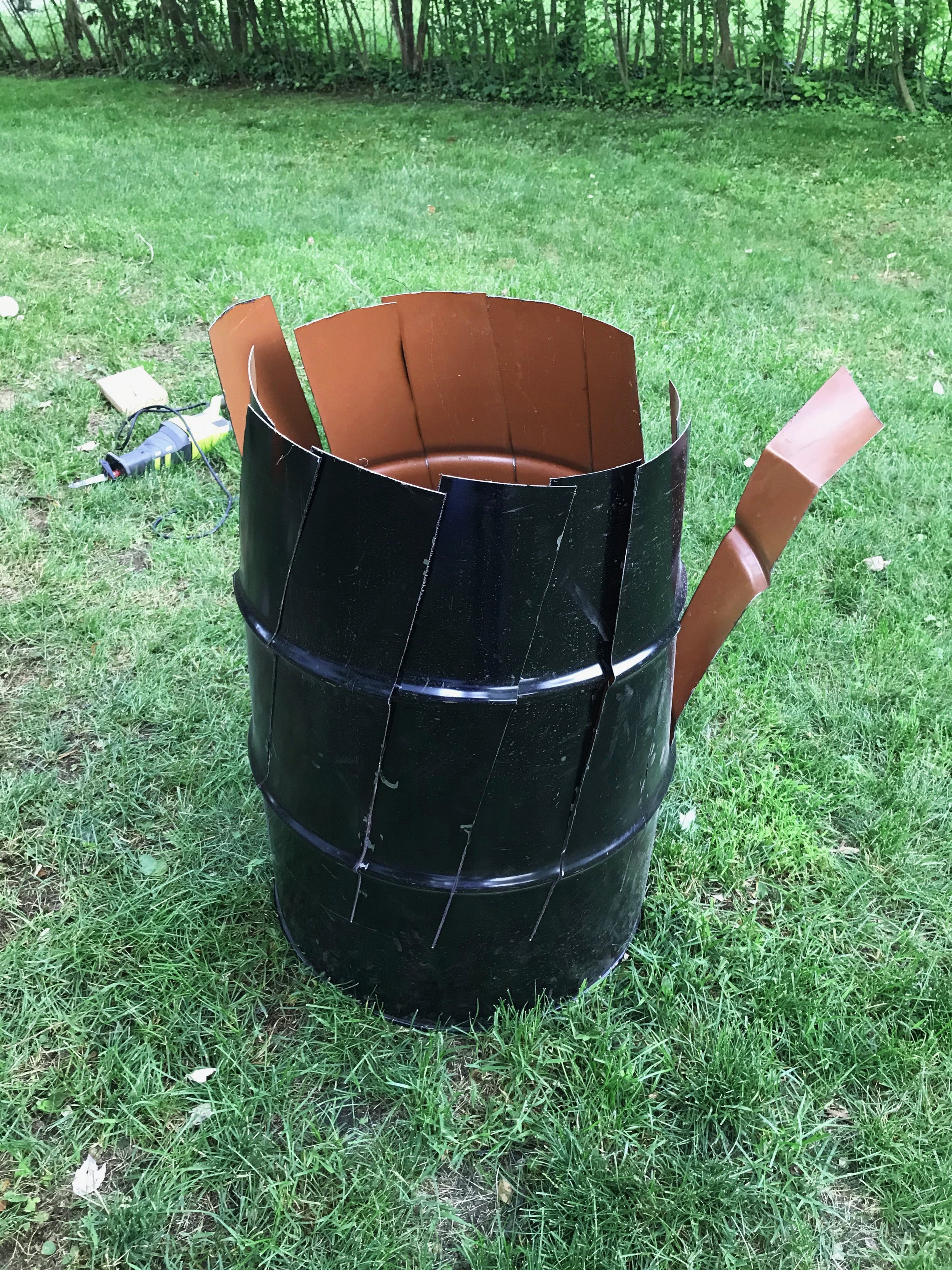 I then removed the top and cut diagonal slices down the sides of the drum.