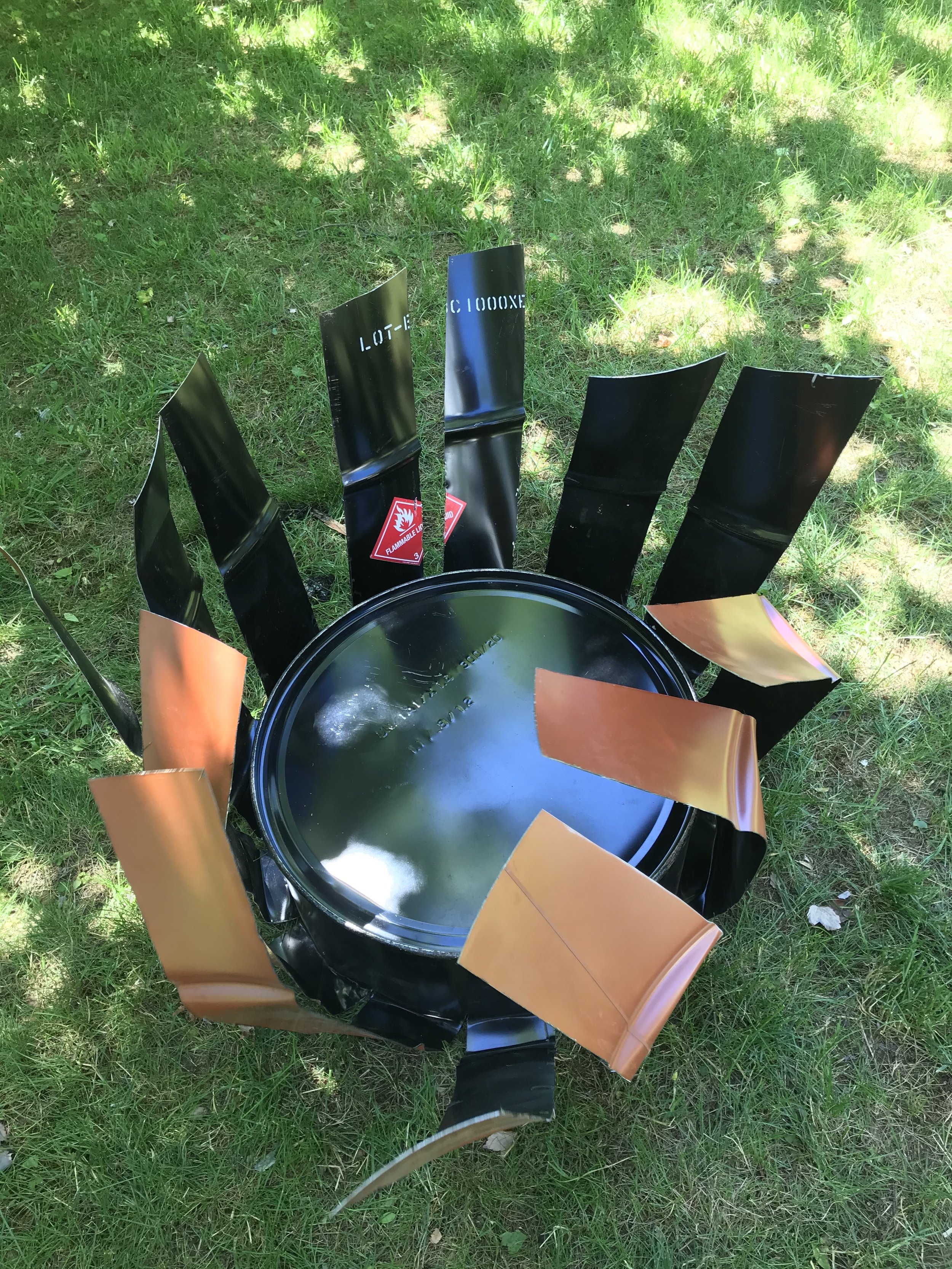 I folded each section back and underneath the bottom of the oil drum.